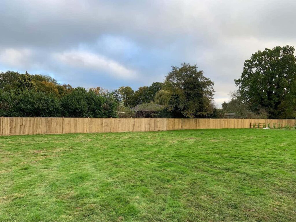 This is a photo of feather edge fencing installed around the edge of a field by Fast Fix Fencing Necton